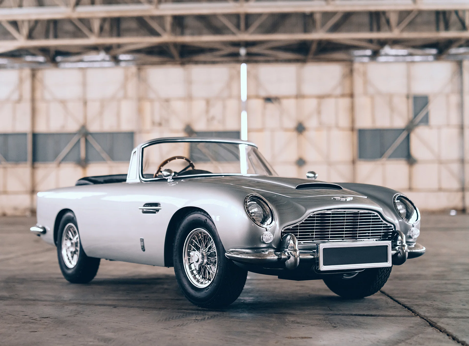 Aston Martin DB5 convertible in a hangar